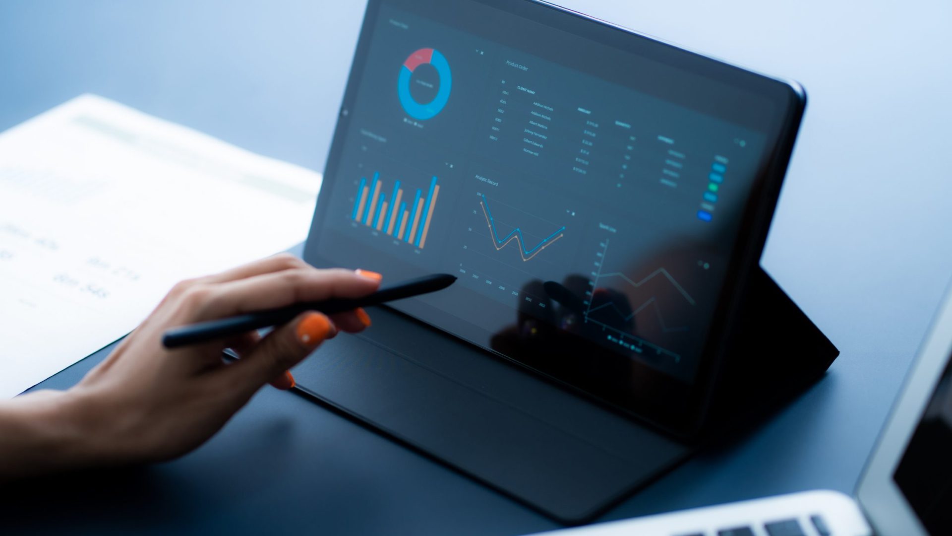 Person viewing business application analytics on a tablet
