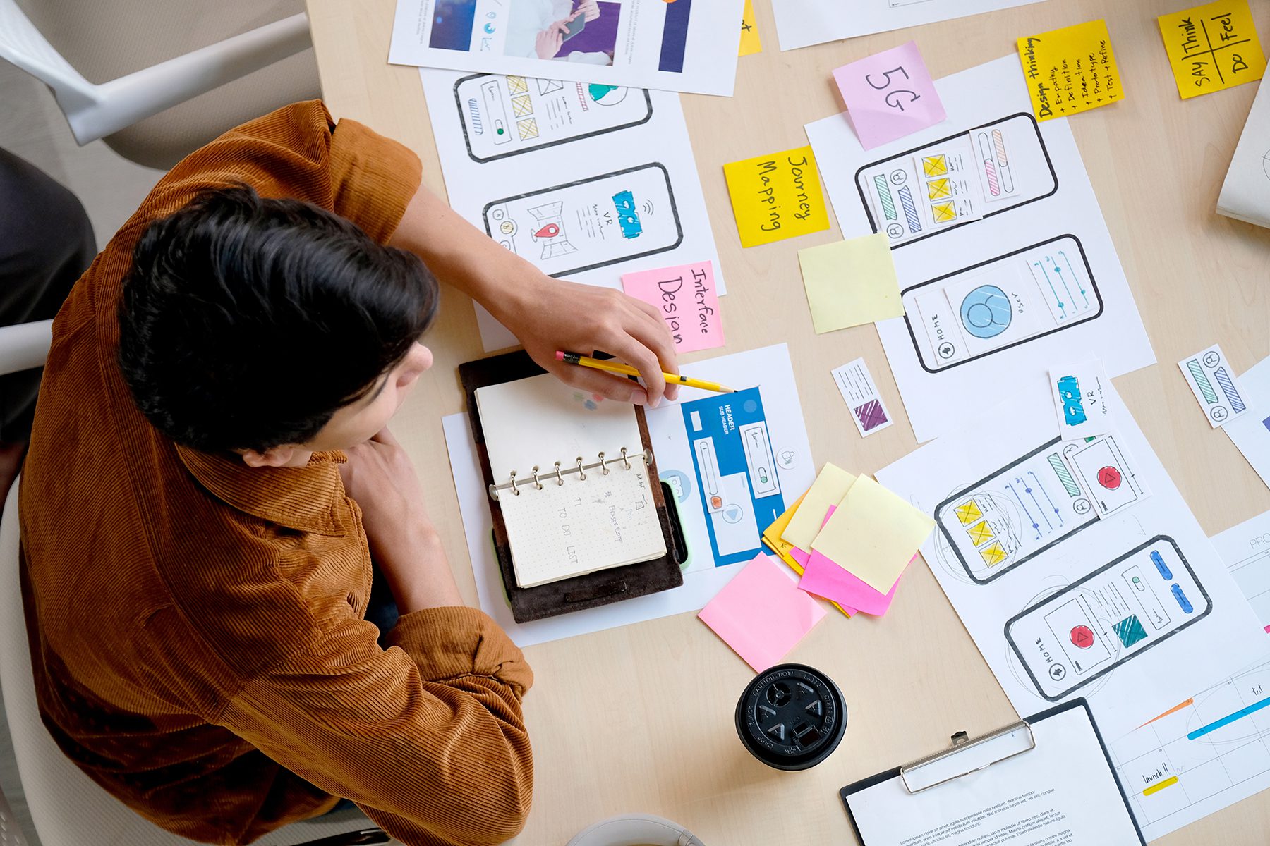 Designer planning a website layout at SBWD Singapore